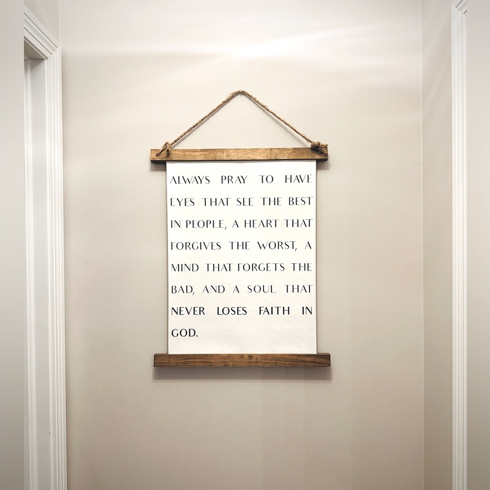 Wall hanging, canvas with wooden top and bottom. Always pray to have eyes that…